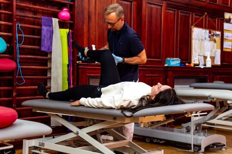 A physiotherapist working with a patient at the rehabilitation centre.
